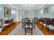 Spacious dining room with hardwood floors, wainscoting, and a charming chandelier at 486 Lantana Circle, Georgetown, SC 29440