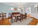 Elegant dining room with hardwood floors, chandelier, and ample seating, perfect for hosting gatherings at 486 Lantana Circle, Georgetown, SC 29440