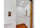 Interior view of a small residential elevator with wood paneling and brass fixtures at 486 Lantana Circle, Georgetown, SC 29440