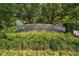 Debordieu Colony sign surrounded by beautiful plants and greenery at 486 Lantana Circle, Georgetown, SC 29440