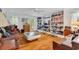 Cozy living room with wood floors, custom built-in bookshelves and eclectic decor at 486 Lantana Circle, Georgetown, SC 29440