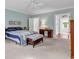 Large main bedroom with natural light, a desk, and a glimpse of the attached bathroom at 486 Lantana Circle, Georgetown, SC 29440