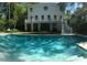 Back of house and pool provides a relaxing outdoor space and entertainment area at 486 Lantana Circle, Georgetown, SC 29440