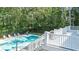Relaxing backyard pool with a large deck, surrounded by lush greenery at 486 Lantana Circle, Georgetown, SC 29440
