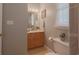 Bathroom with single sink vanity, neutral paint, and tile floors at 618 6Th Ave. N, Surfside Beach, SC 29575