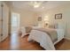 Bedroom featuring two twin beds, ceiling fan, and hardwood floors at 618 6Th Ave. N, Surfside Beach, SC 29575