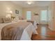 Bedroom featuring two twin beds, ceiling fan, and two windows at 618 6Th Ave. N, Surfside Beach, SC 29575