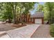 Brick home with a two-car garage, landscaped yard, and a long driveway at 618 6Th Ave. N, Surfside Beach, SC 29575