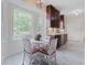 Eat-in kitchen featuring a table with seating and a large window with natural light at 618 6Th Ave. N, Surfside Beach, SC 29575