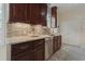 Kitchen with stainless steel dishwasher, tiled backsplash and wood cabinets at 618 6Th Ave. N, Surfside Beach, SC 29575