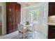 Kitchen nook with bay window and white table with seating and a view to the backyard at 618 6Th Ave. N, Surfside Beach, SC 29575