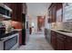 Galley kitchen features stainless appliances, tile backsplash, and wood cabinetry at 618 6Th Ave. N, Surfside Beach, SC 29575