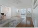 An open-concept living room with hardwood floors, neutral paint, and a ceiling fan at 618 6Th Ave. N, Surfside Beach, SC 29575
