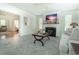 Cozy living room with fireplace, ceiling fan and open doorway at 618 6Th Ave. N, Surfside Beach, SC 29575
