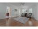 Living room with hardwood floors, ceiling fan, and neutral paint color with ample natural light at 618 6Th Ave. N, Surfside Beach, SC 29575