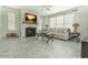 Bright living room boasts fireplace, ceiling fan and large windows at 618 6Th Ave. N, Surfside Beach, SC 29575