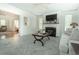 Cozy living room with fireplace, ceiling fan and open doorway at 618 6Th Ave. N, Surfside Beach, SC 29575