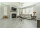 Bright living room boasts fireplace, ceiling fan and large windows at 618 6Th Ave. N, Surfside Beach, SC 29575