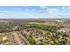 Expansive aerial shot shows the home's location within a tree-lined residential area at 706 Birch Ln., Conway, SC 29526