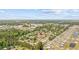 Wide aerial view shows the home's location in a neighborhood near a shopping area at 706 Birch Ln., Conway, SC 29526