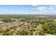 Wide aerial image displays the home in a leafy neighborhood surrounded by mature trees at 706 Birch Ln., Conway, SC 29526