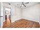 Clean, neutral bedroom with hardwood floors and direct access to other rooms at 706 Birch Ln., Conway, SC 29526