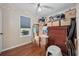 Bedroom filled with boxes with a ceiling fan, wood floors, and a large window at 706 Birch Ln., Conway, SC 29526