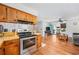 Open-concept kitchen featuring oak cabinets, stainless steel oven and living area at 706 Birch Ln., Conway, SC 29526