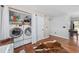 This laundry room features a stacked washer and dryer with overhead shelving at 706 Birch Ln., Conway, SC 29526