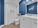 This bathroom showcases a tub and shower combination with subway tile and blue painted walls at 800 9Th Ave. S # A-4, North Myrtle Beach, SC 29582
