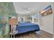 Bright and airy bedroom showcases a colorful accent wall and a wall-mounted TV at 800 9Th Ave. S # A-4, North Myrtle Beach, SC 29582
