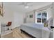 Bedroom boasts natural light, double door closet, desk, and bright windows showcasing the neighborhood at 800 9Th Ave. S # A-4, North Myrtle Beach, SC 29582