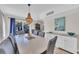 Elegant dining room featuring a large dining table, comfortable chairs, and stylish decor at 800 9Th Ave. S # A-4, North Myrtle Beach, SC 29582