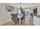 Inviting dining room with ample seating and sliding glass doors leading to outdoor patio at 800 9Th Ave. S # A-4, North Myrtle Beach, SC 29582