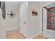 Hallway showcases a colorful bathroom with unique wallpaper, creating a visually appealing transition space at 800 9Th Ave. S # A-4, North Myrtle Beach, SC 29582