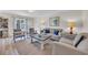 Inviting living room featuring a comfortable sofa, stylish chairs, neutral colors, and wood flooring at 800 9Th Ave. S # A-4, North Myrtle Beach, SC 29582