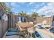 Outdoor patio features a dining set and lounge chairs surrounded by a privacy fence at 800 9Th Ave. S # A-4, North Myrtle Beach, SC 29582