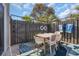 Enclosed patio with outdoor dining area, decorative rug, and secure fencing for privacy at 800 9Th Ave. S # A-4, North Myrtle Beach, SC 29582
