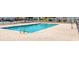 Outdoor pool with brick pavers surrounded by a black fence, perfect for relaxing in the sun at 800 9Th Ave. S # A-4, North Myrtle Beach, SC 29582