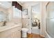 This bathroom features a sink, toilet, and glass shower with a door to the bedroom at 820 9Th Ave. S, North Myrtle Beach, SC 29582
