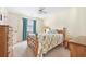 This cozy bedroom has carpet flooring, a ceiling fan and wood furniture at 820 9Th Ave. S, North Myrtle Beach, SC 29582