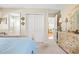 This bedroom is home to a queen bed and dresser with access to a linen closet and bathroom at 820 9Th Ave. S, North Myrtle Beach, SC 29582