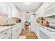 Well-lit kitchen boasting white cabinetry, modern appliances, and ample counter space at 820 9Th Ave. S, North Myrtle Beach, SC 29582