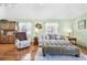 Relaxing living room featuring a plush sofa, ottoman, and stylish furnishings at 820 9Th Ave. S, North Myrtle Beach, SC 29582