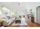 Bright living room showcasing hardwood floors, neutral decor, and sliding glass doors at 820 9Th Ave. S, North Myrtle Beach, SC 29582