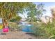Scenic community pond with a fountain, surrounded by lush landscaping and mature trees at 820 9Th Ave. S, North Myrtle Beach, SC 29582