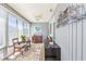 Inviting sunroom with multiple windows, neutral decor, and comfortable seating at 820 9Th Ave. S, North Myrtle Beach, SC 29582