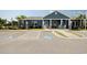 Charming clubhouse featuring rocking chairs on the porch and accessible parking spots at 830 San Marco Ct. # 2603-B, Myrtle Beach, SC 29579