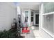 Cozy front porch with decorative welcome sign, rocking chair, and charming decor at 830 San Marco Ct. # 2603-B, Myrtle Beach, SC 29579