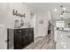 Hallway showcasing stylish decor and durable hardwood floors, leading to bright living spaces at 830 San Marco Ct. # 2603-B, Myrtle Beach, SC 29579